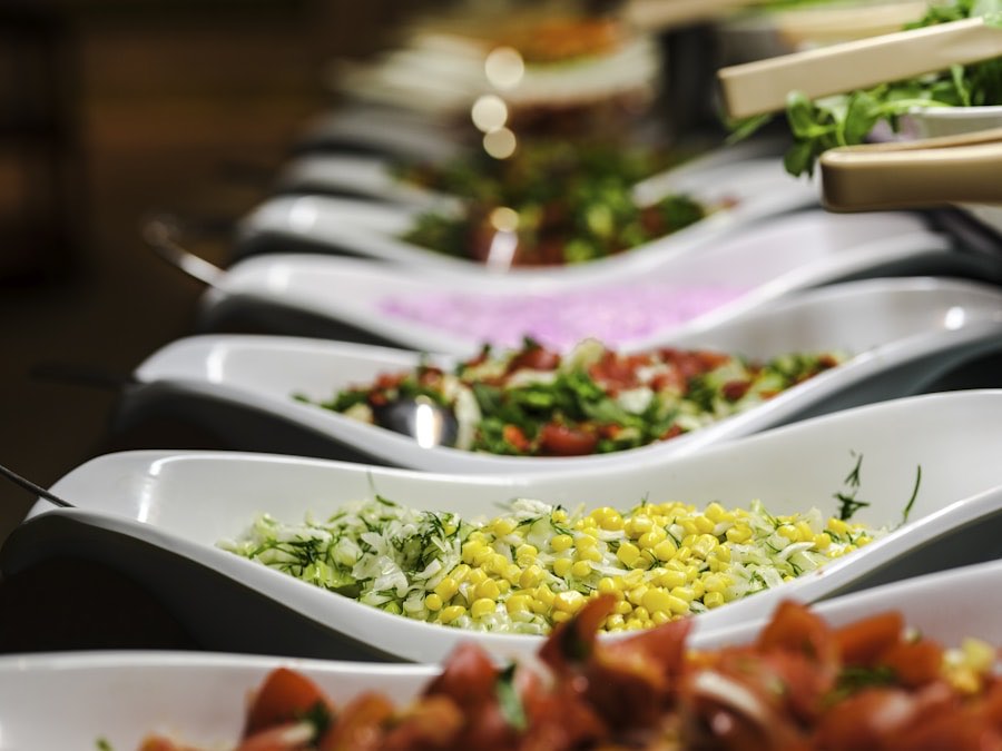 Table of vegetarian dishes plated and ready for service at a function